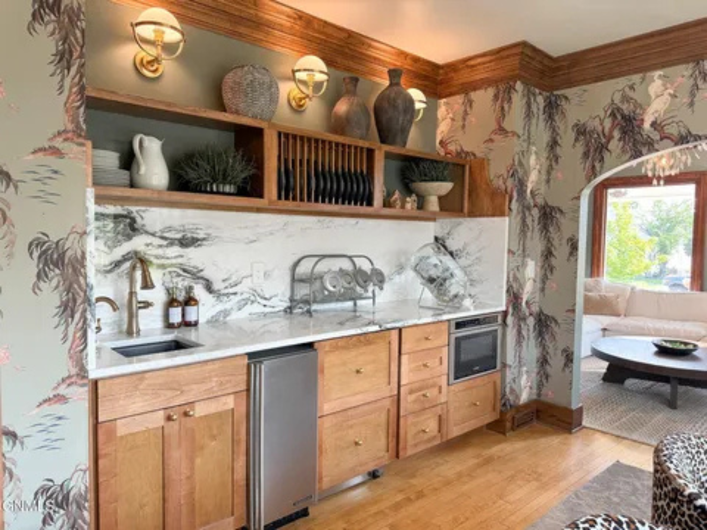 A bright kitchen with plenty of storage, and a cozy dining spot nearby.