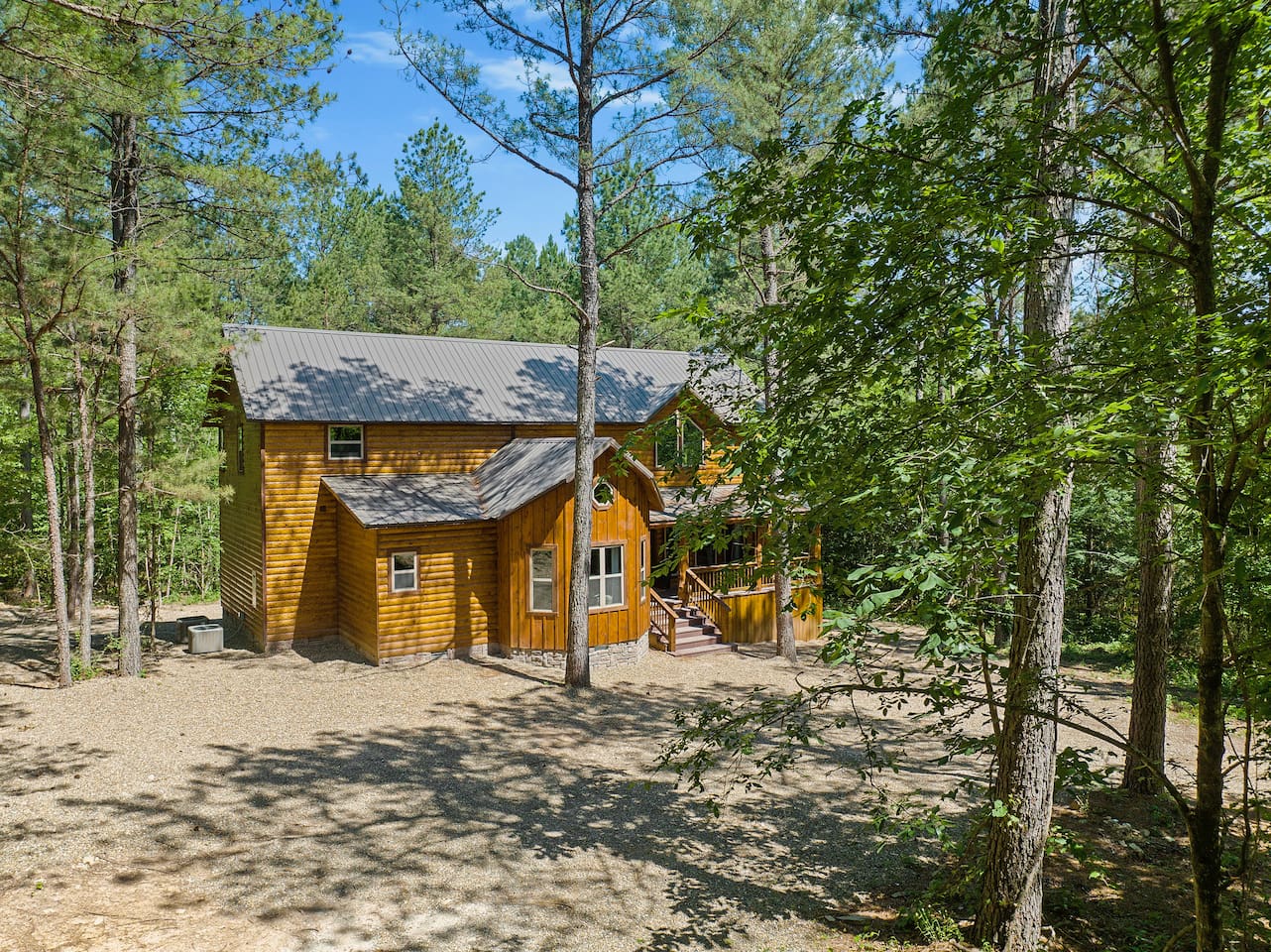 Nestled in serene forest surroundings, the cabin offers peace, privacy, and natural beauty at every glance.