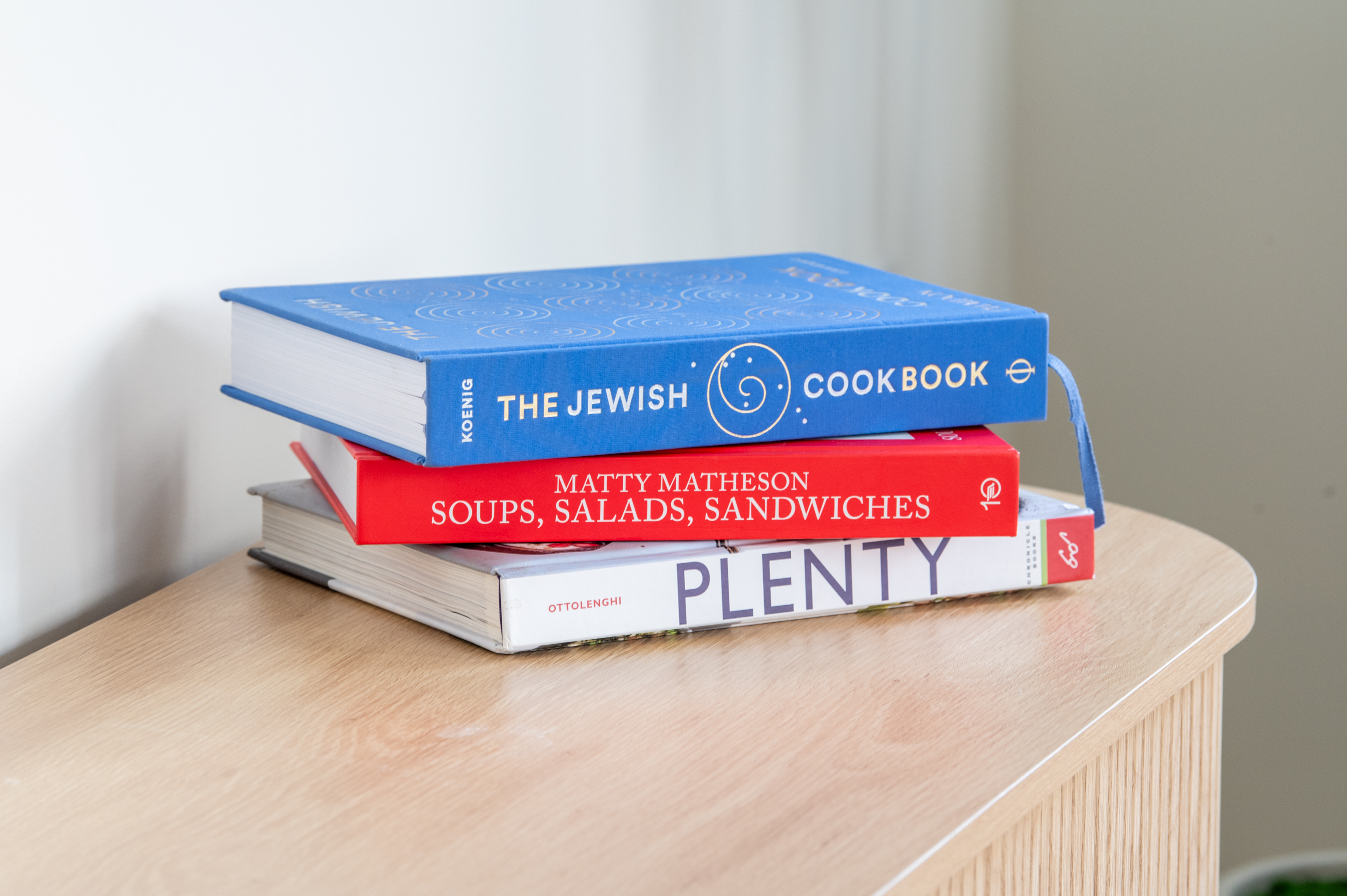 Touch of personality—stack of colorful cookbooks for added charm