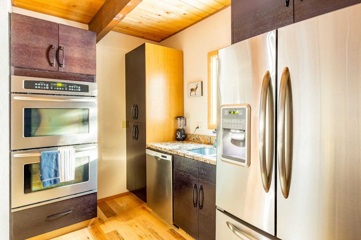 The kitchen is open to the dining room and features TWO ovens for all your baking needs!