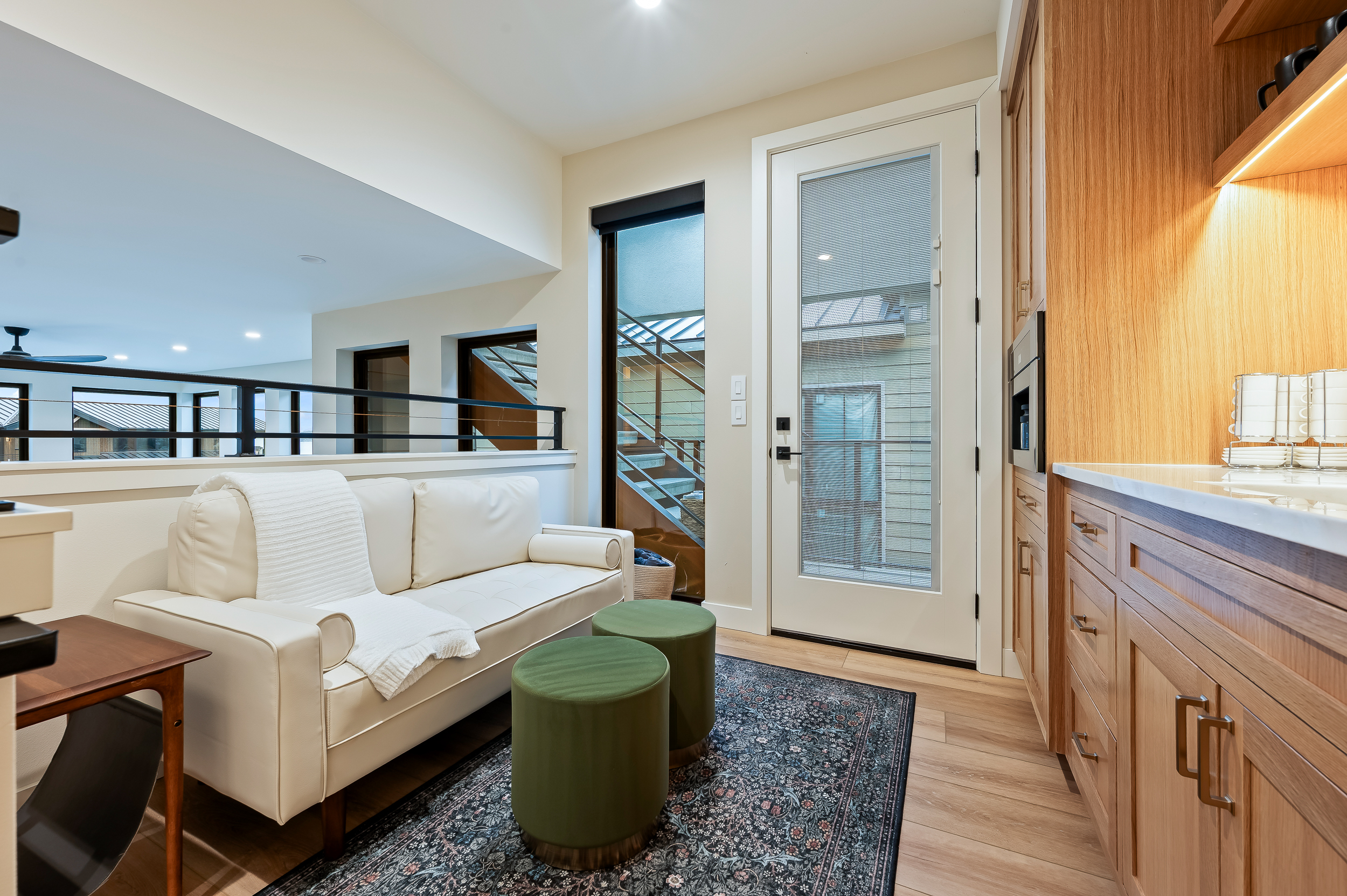 Upstairs lounge and coffee bar area with Miele espresso maker and mini fridge