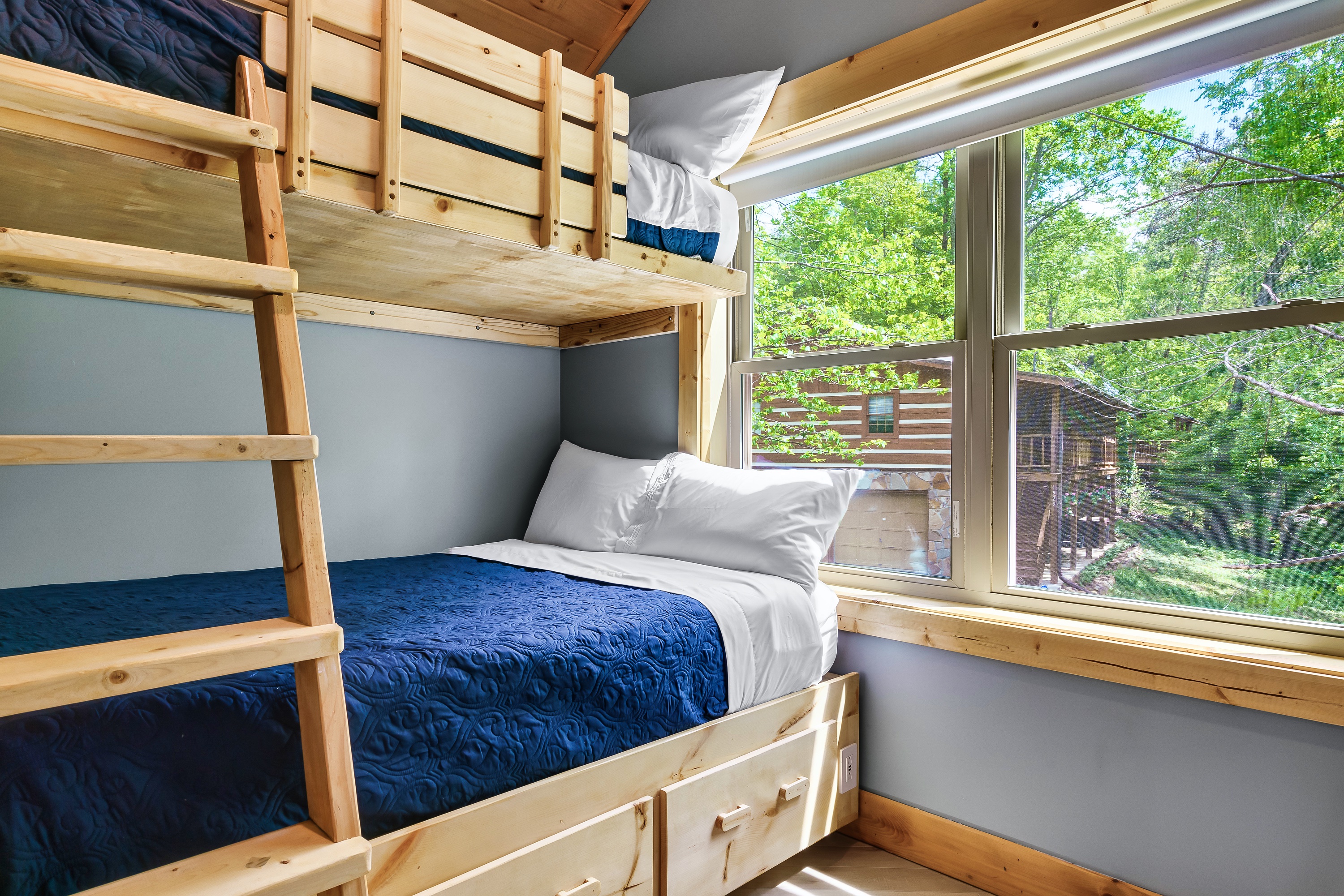 Twin over full custom bunk beds are sure to make our smallest guests happy. There is also a storage drawer underneath with the extra bedding for the pull out couch.