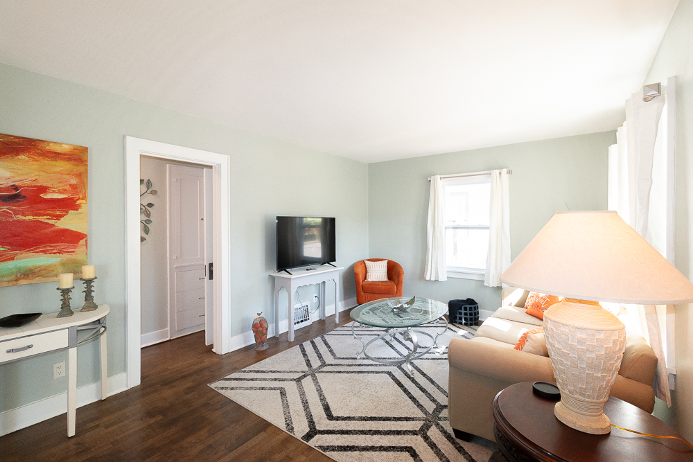 Unwind in this light-filled living room, perfect for movie nights or morning coffee.