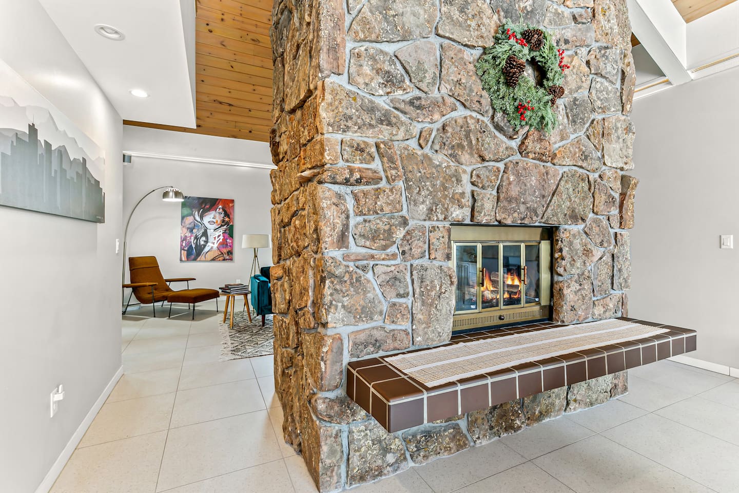 Our enchanting living room and dining room share a two-sided fireplace, creating a warm and inviting ambiance for both relaxation and dining experiences.