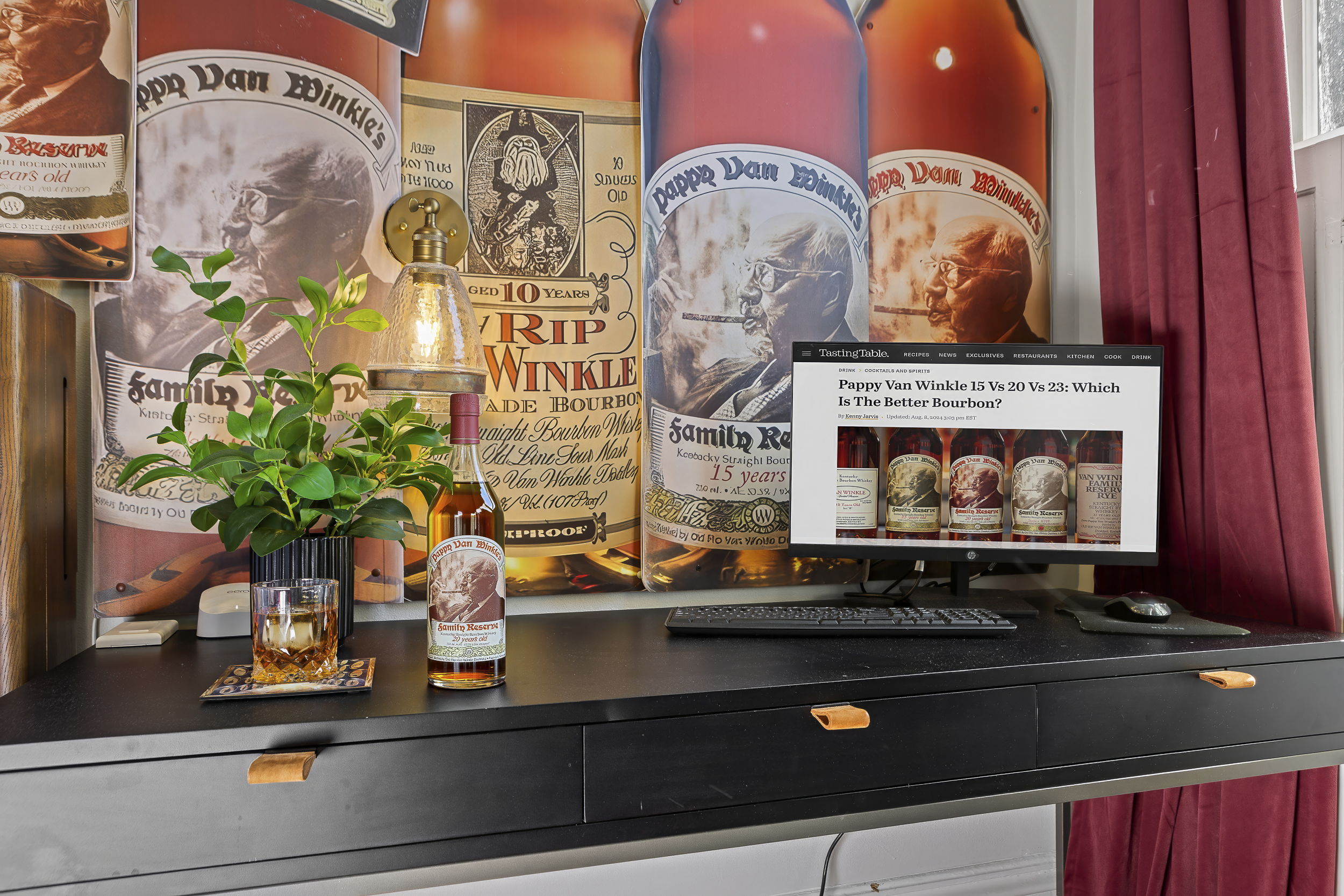 Coffee on the desk, Pappyland within reach, and a Van Winkle mural overhead create a workspace that's as inspiring as it is comfortable.