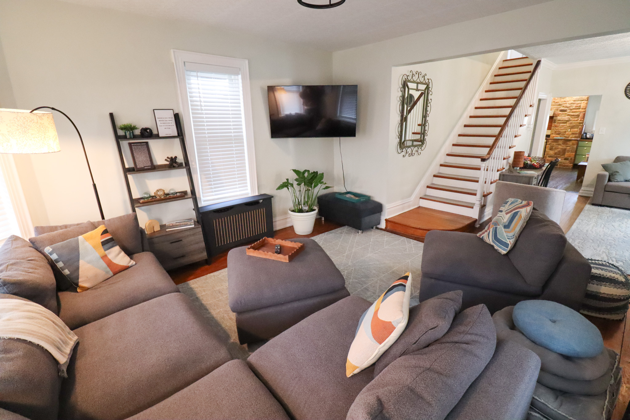 Spacious living room with large sectional seating smart TV and open layout