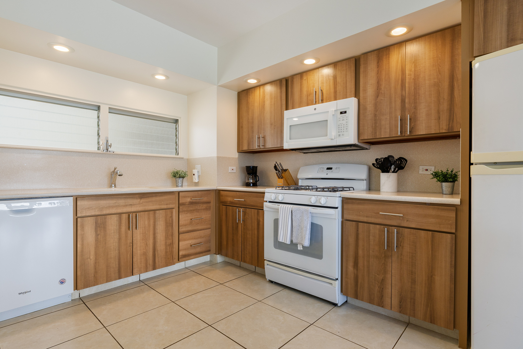 Full kitchen with range/oven, refrigerator and dishwasher 