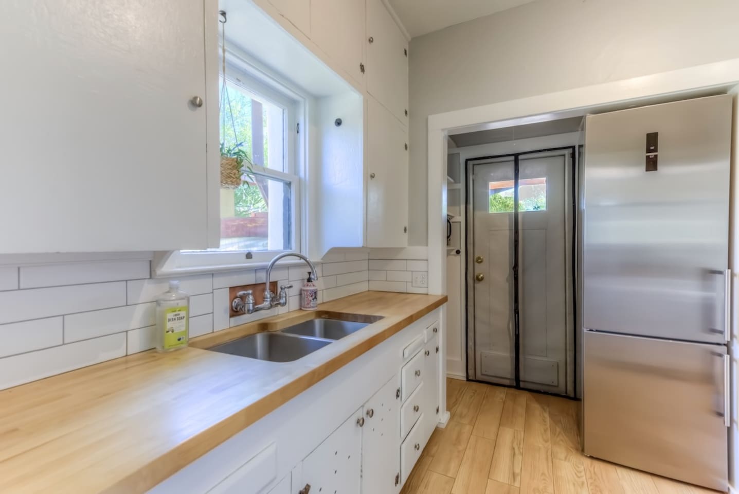 kitchen sink with door to back patio