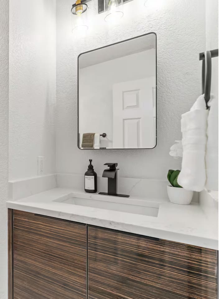 This stylish bathroom is perfect for pampering and unwinding in style. Featuring premium towels, shampoo, conditioner, hand soap, and body wash