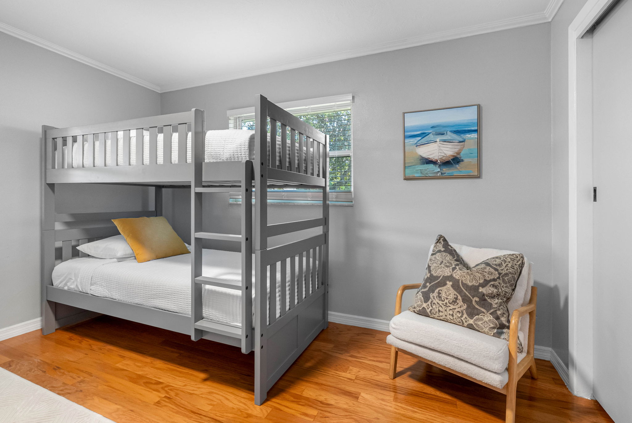 Perfect for the kids or a group of friends, this bright bunk room sleeps four comfortably with two twin-over-twin bunk beds.