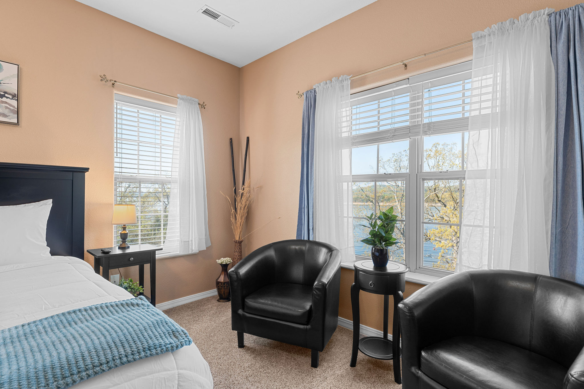 The primary bedroom even has a sitting area with lots of natural light