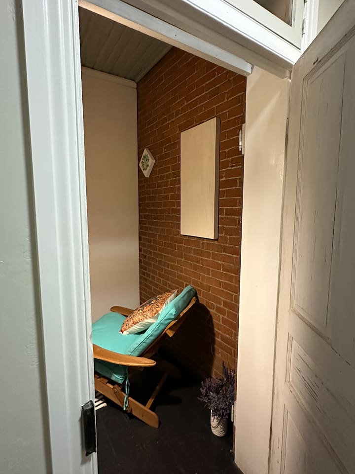 enclosed porch room lovely area to sit and read and have morning coffee