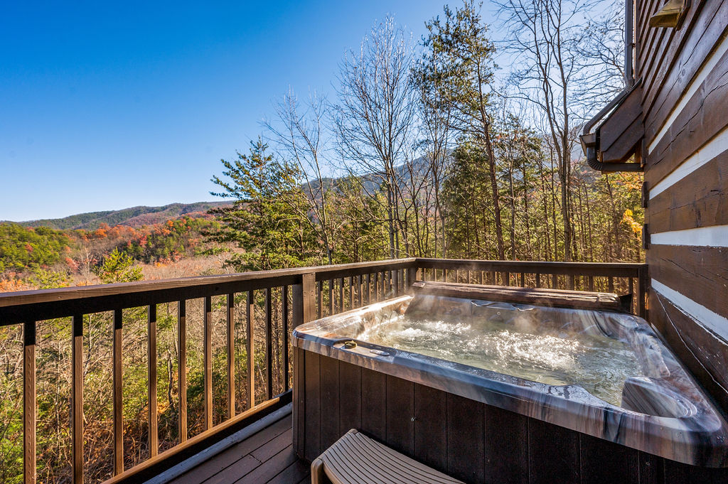 Escape into your own personal oasis with our hot tub, featuring stunning views of the majestic mountains