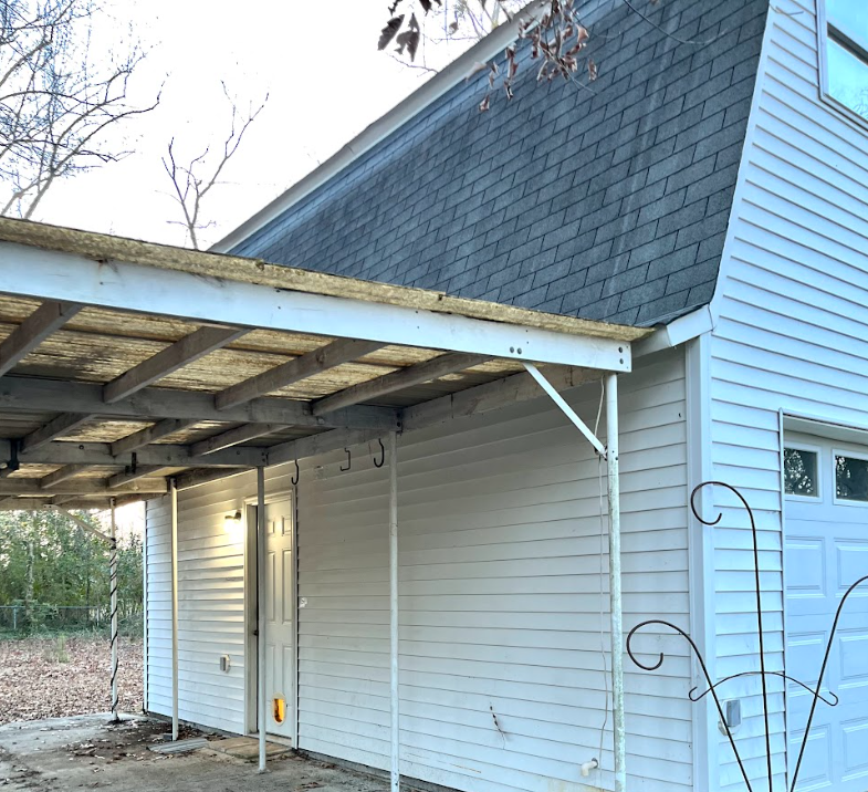 Williams Studio — The keypad door under the carport is the only guest entrance.