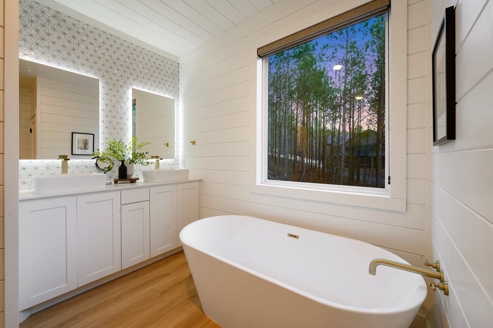 Enjoy peaceful forest views from the soaking tub for the ultimate unwind.
