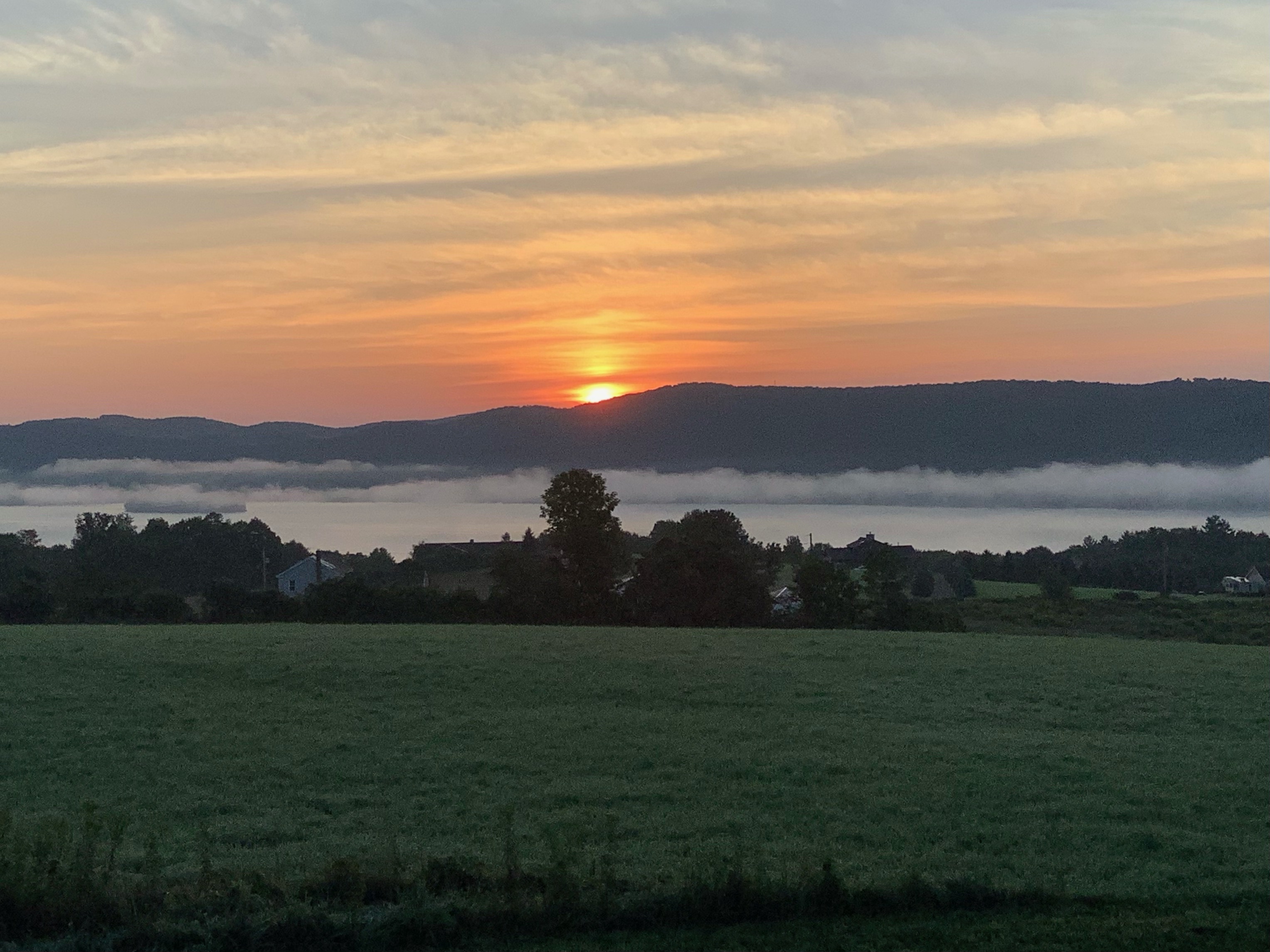 Sunrise over Canadarago with lifting morning fog