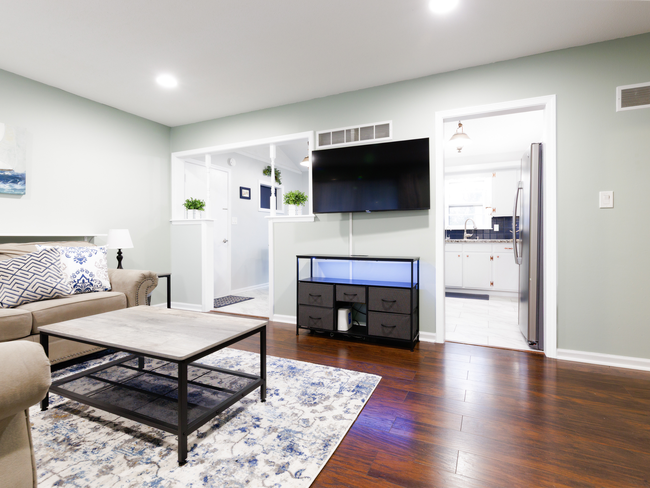 Relaxing living space with TV and open layout, perfect for unwinding or gathering together.