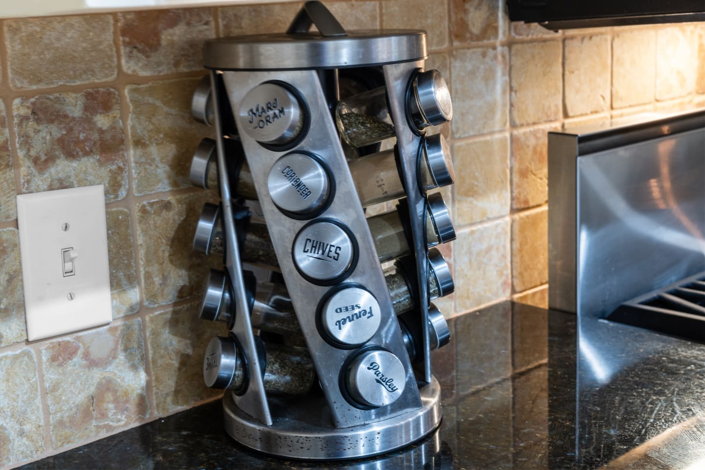 Fully stocked spice rack ready for your next home-cooked meal—perfect for guests who love to cook.