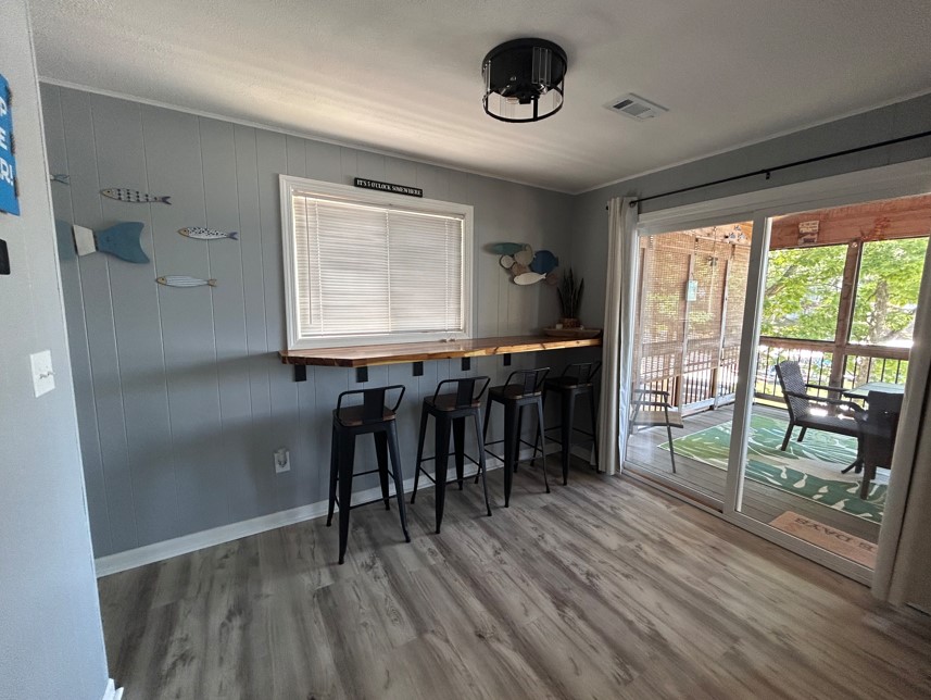 Bar top dining near the screened-in deck.