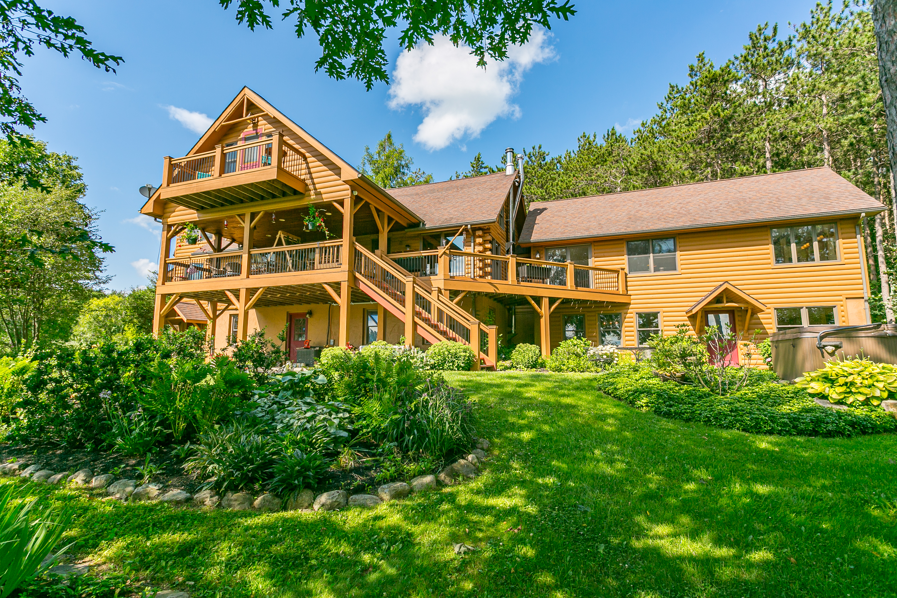Multiple decks and porches provide sweeping views and endless spots to relax, dine, and enjoy the outdoors in style.