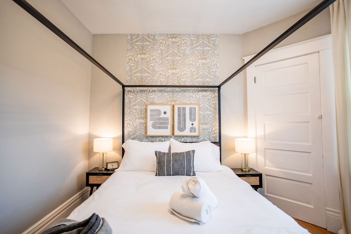 Cozy bedroom featuring a stylish bedframe, adding a touch of elegance and comfort to the space for a restful night's sleep.