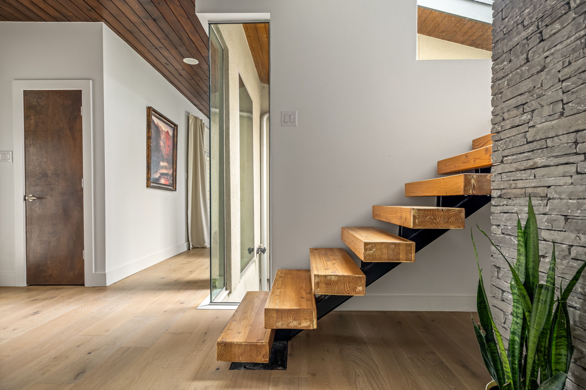 Architectural stairwell with floating wood steps
