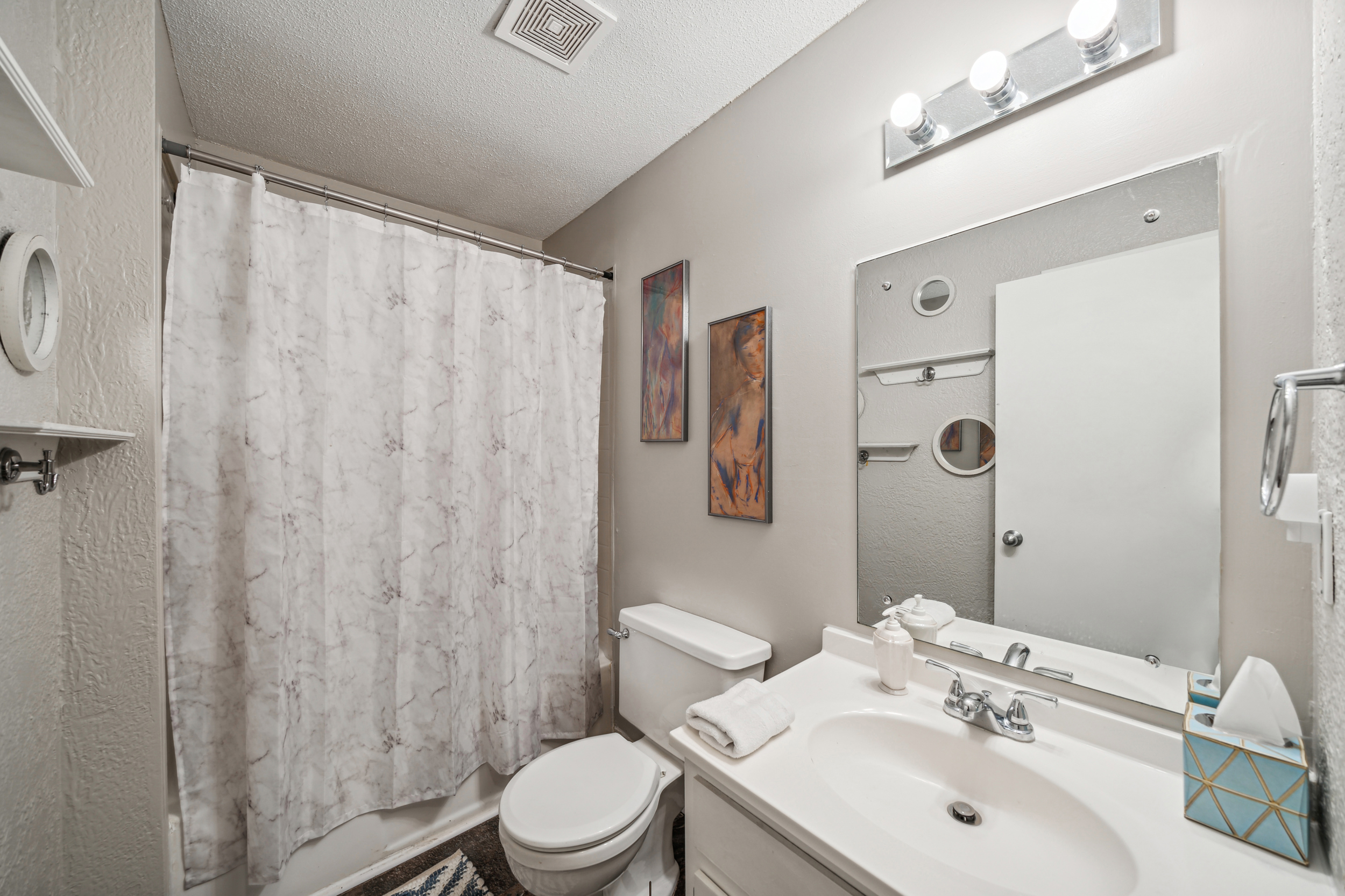 The bathroom offers a full tub/shower.