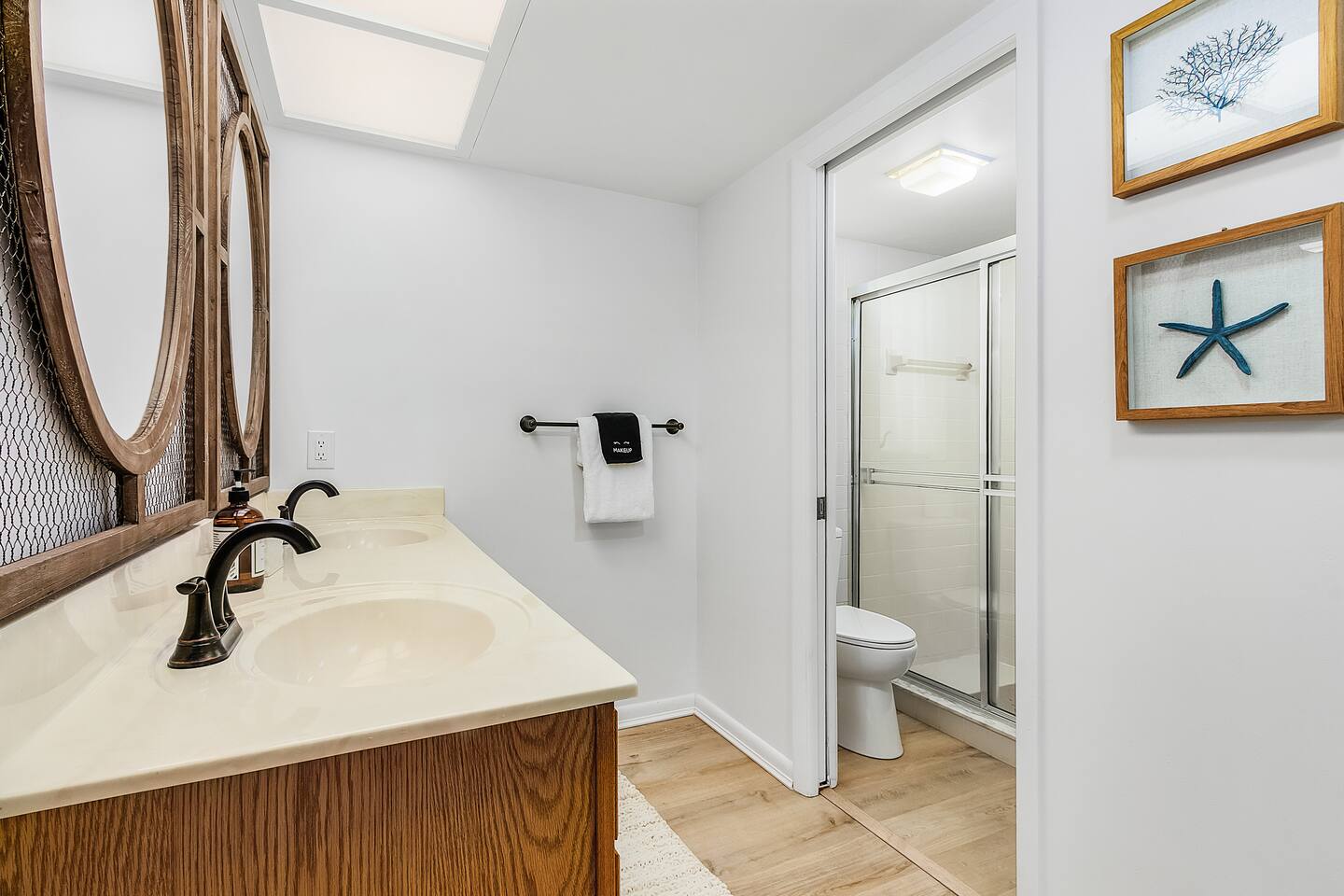 Refresh in the primary ensuite bathroom, featuring dual sinks and a spacious shower for your comfort and convenience!