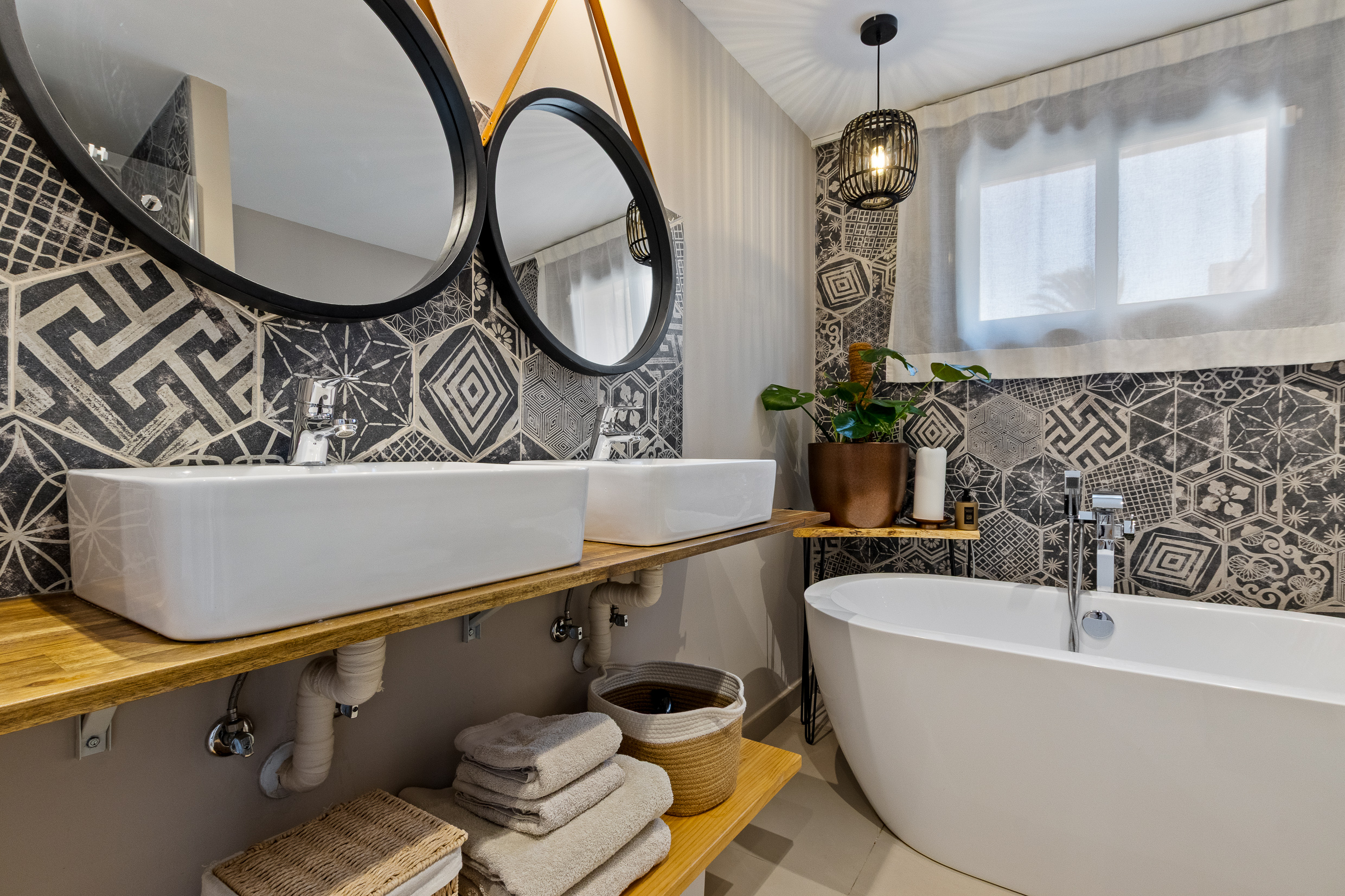 Boutique-style bathroom with freestanding tub and double vanity
