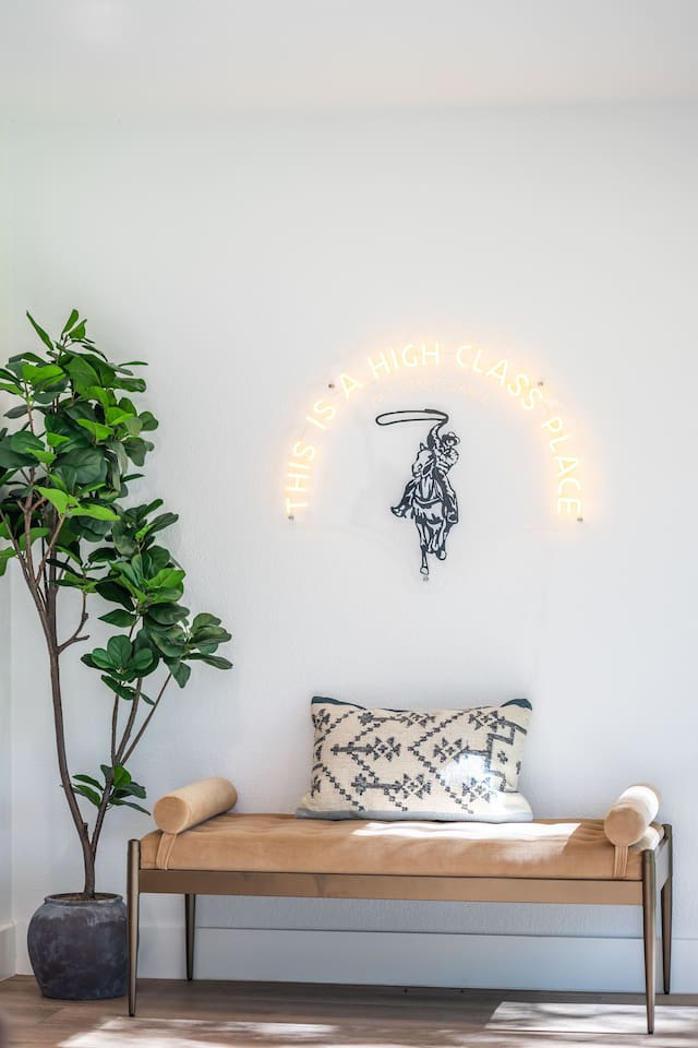 Versatile bench seating by the back door offers a convenient spot for shoes or bags and can be used as additional seating anywhere in the home.