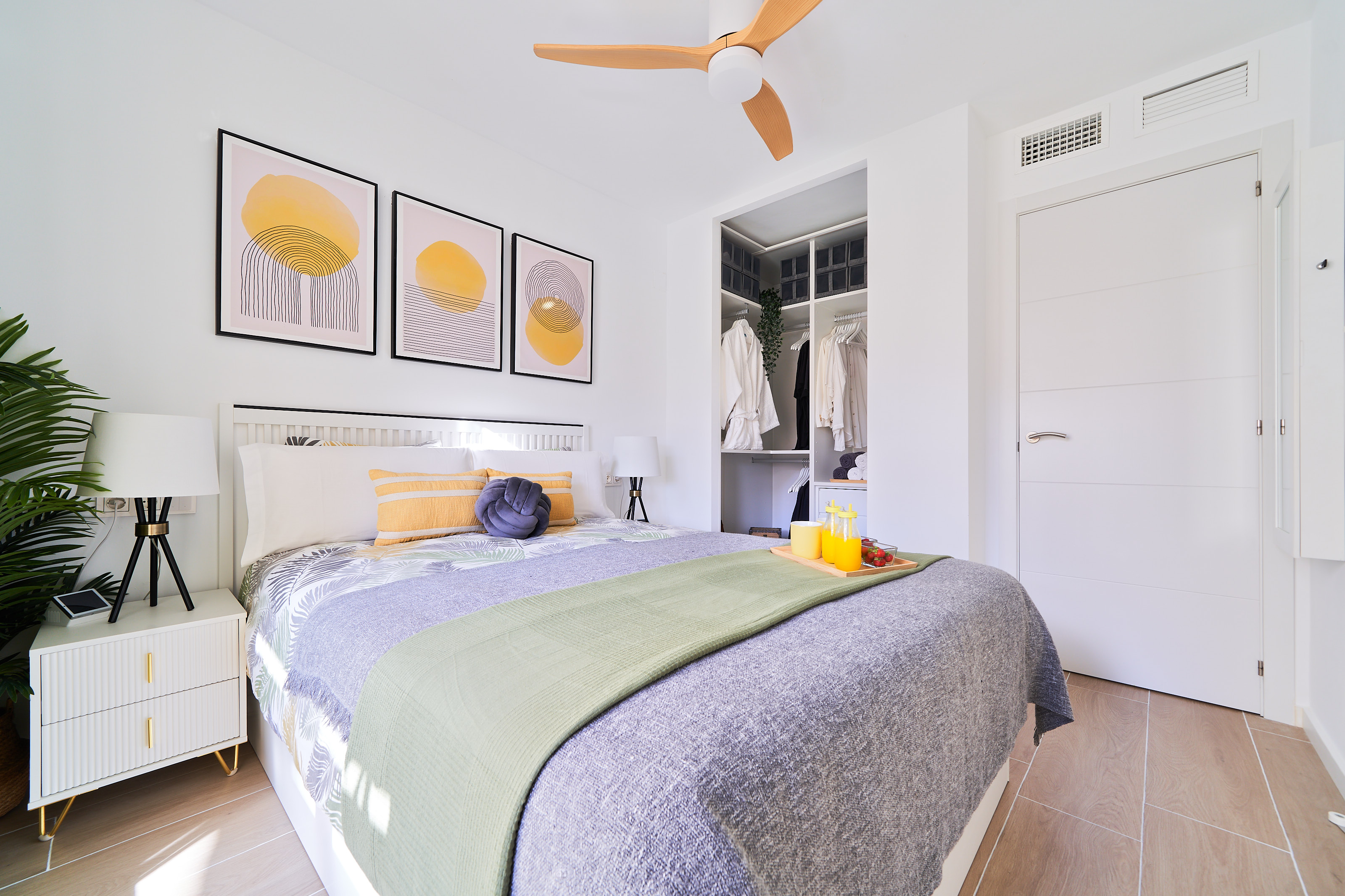 Bright and elegant master bedroom with a private terrace, walk-in wardrobe, and a serene atmosphere designed for restful nights.