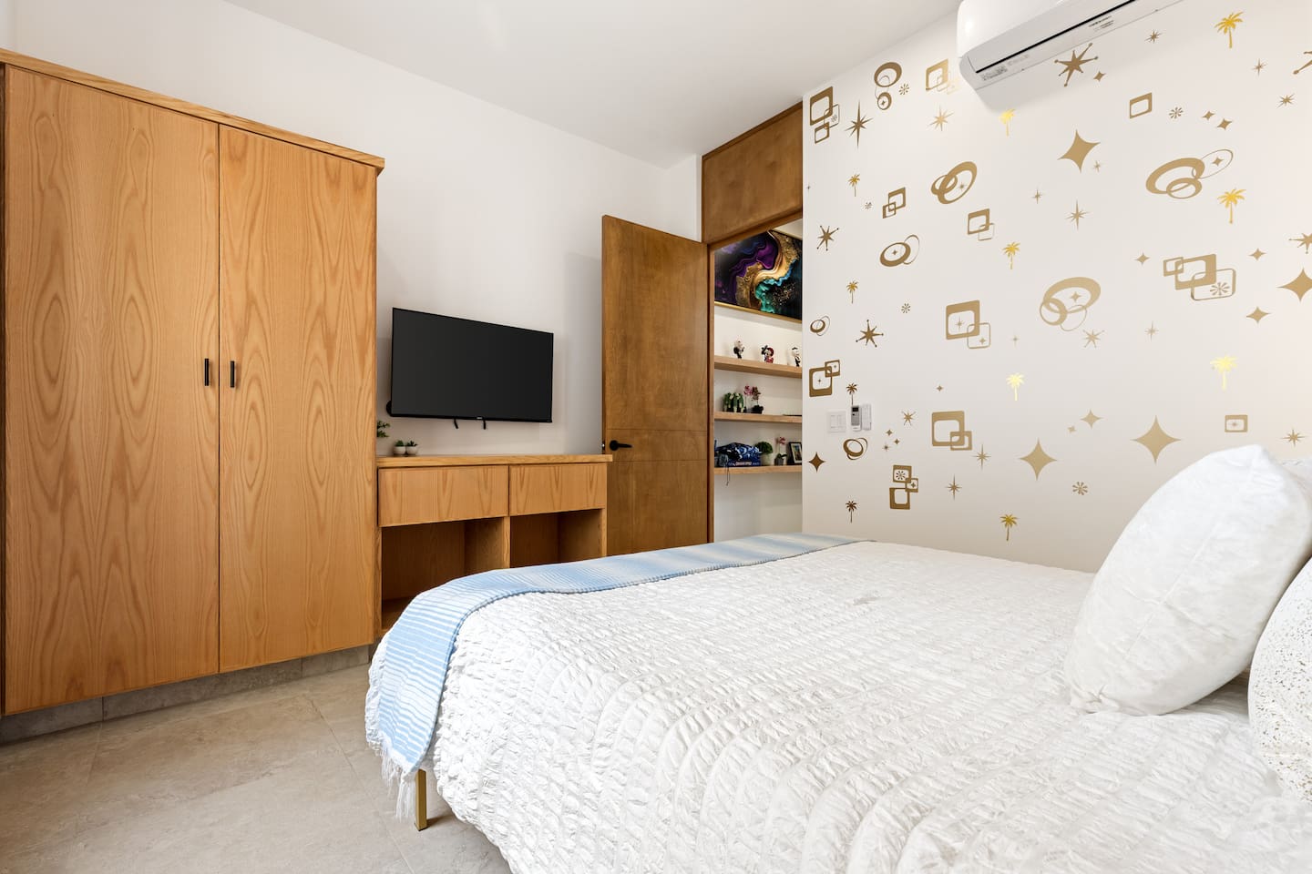 Experience the serene and upscale ambiance of this Cabo guest room, evoking tranquility with its plush comfort and breathtaking mountain views.