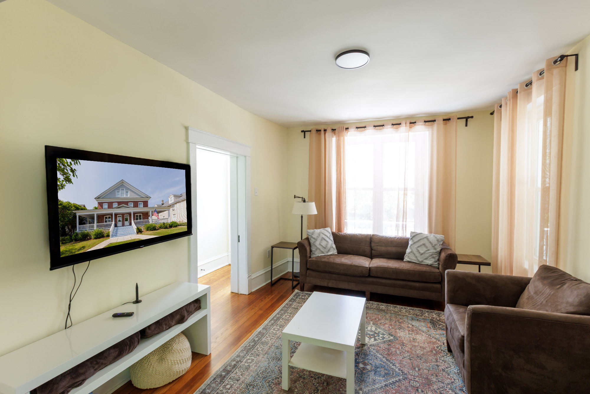 Living room with comfortable seating and a Smart TV.