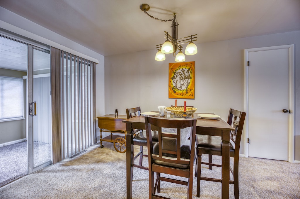 Space adorned with beautiful Kenyan artwork for a mix of culture & modern. Dining room next to Sunroom.