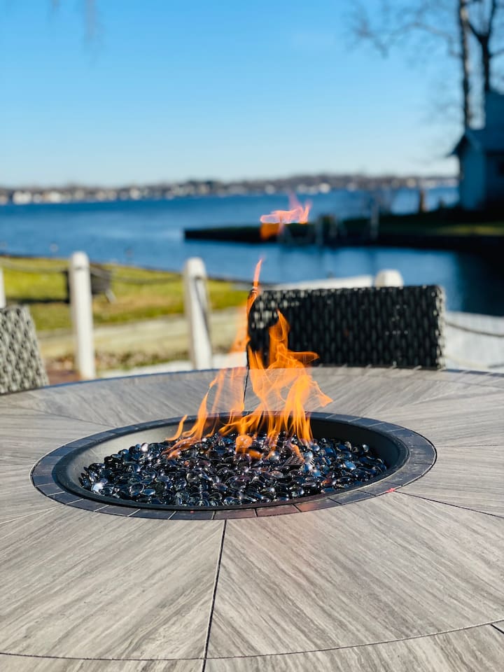 Outdoor table with a fire pit perfet for gathering under the stars.