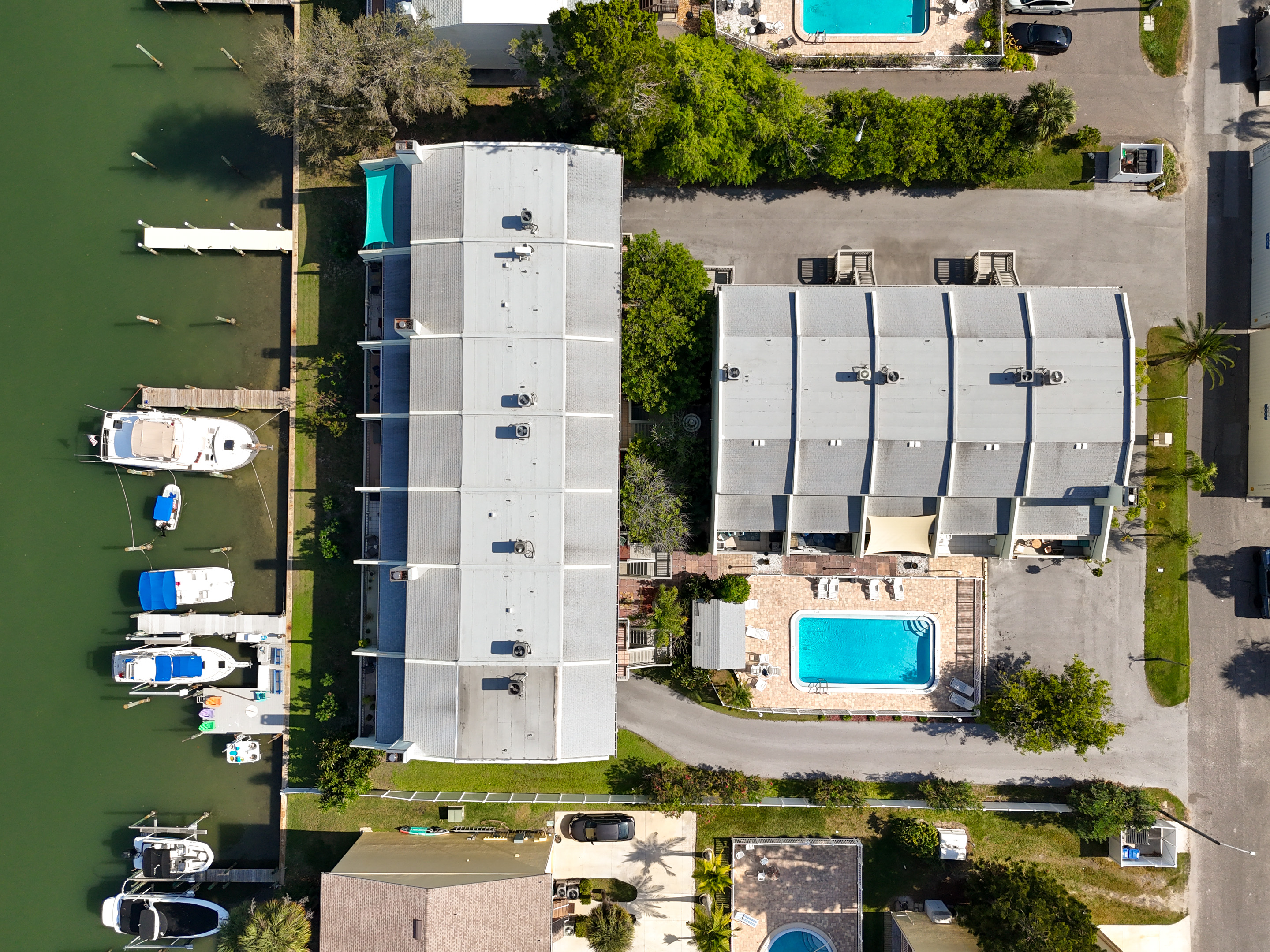 Overhead view of the building, pool and parking