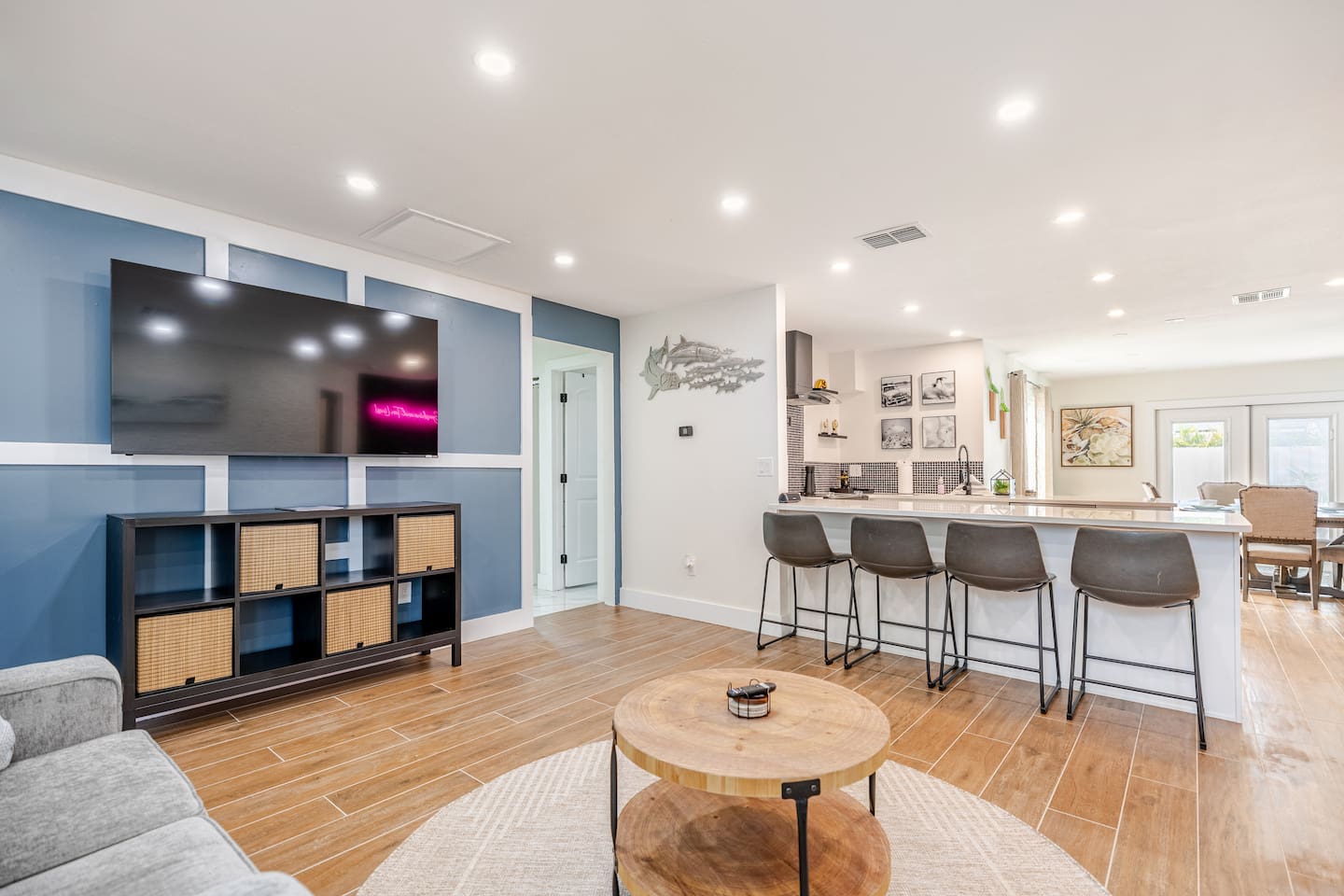 The living room is directly off the open kitchen. Perfect for gathering with family and friends. 