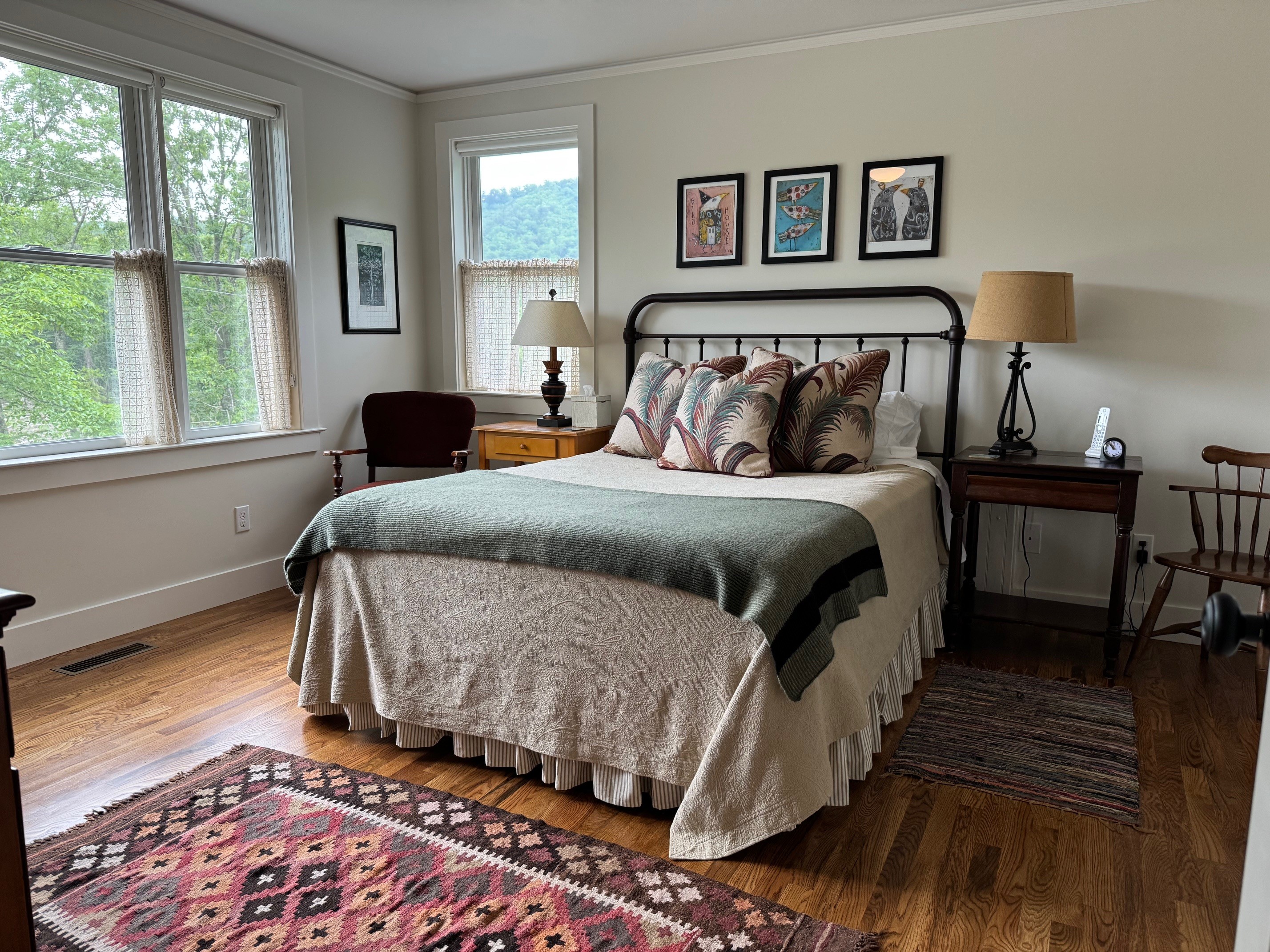 The upstairs queen bedroom bathed in natural light.