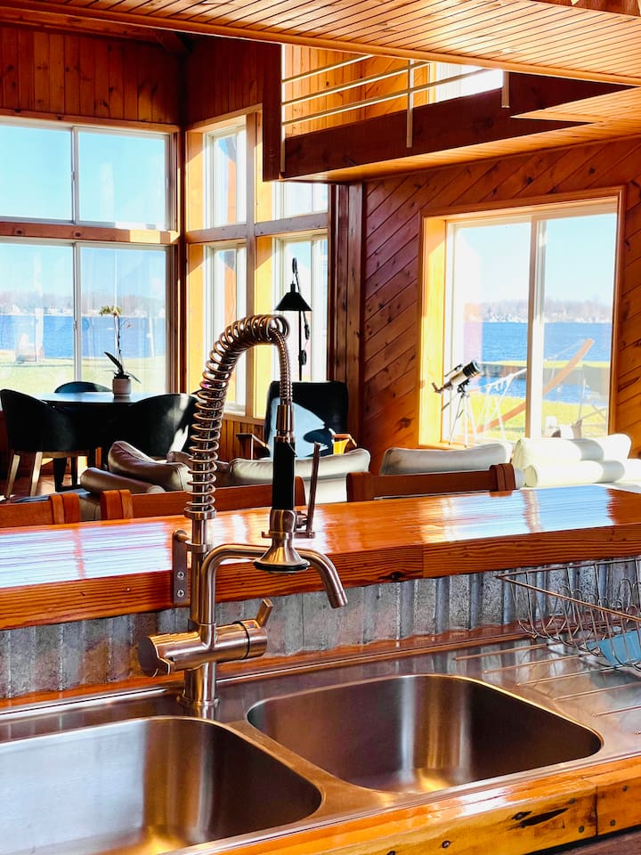 Kitchen with lake views while preparing meals.
