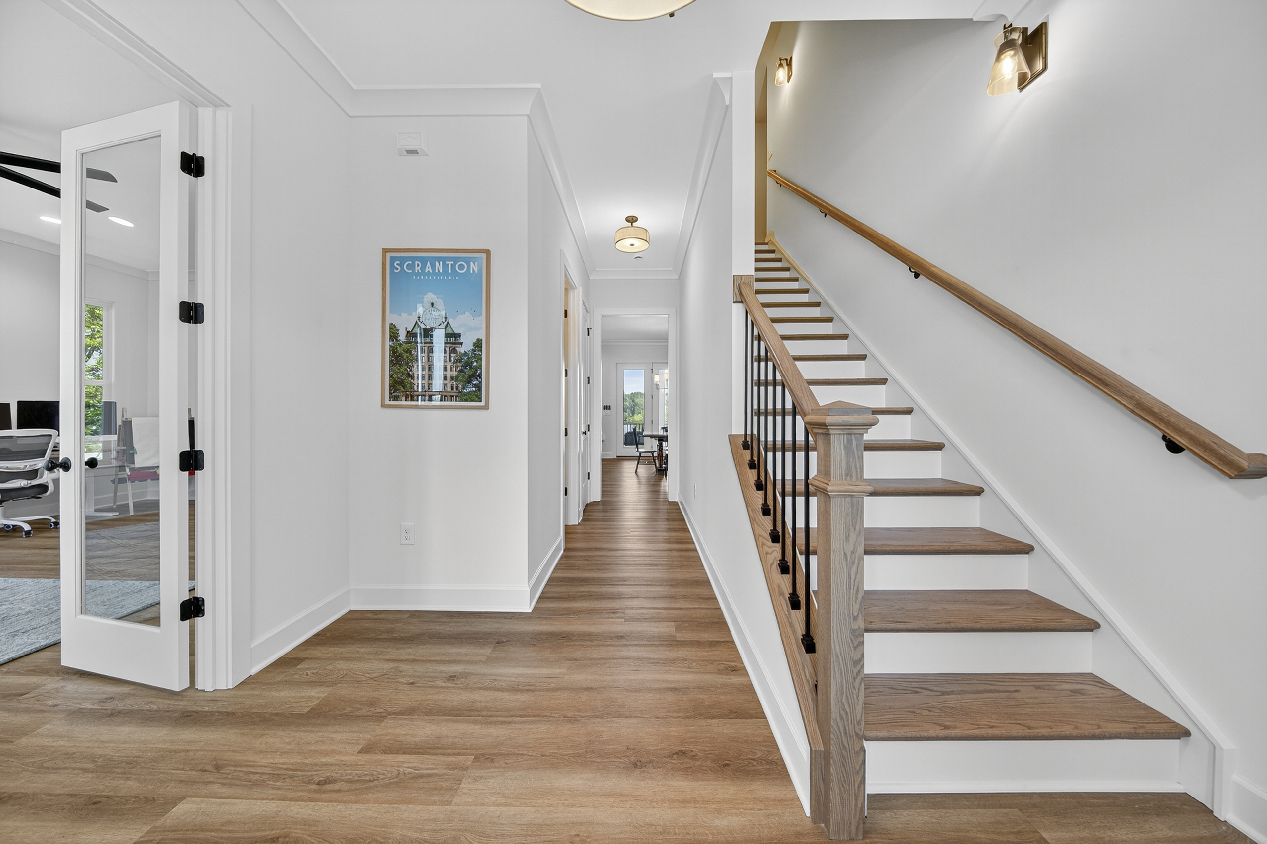 Bright and spacious entryway with modern lighting, leading to lake views and comfortable living spaces.