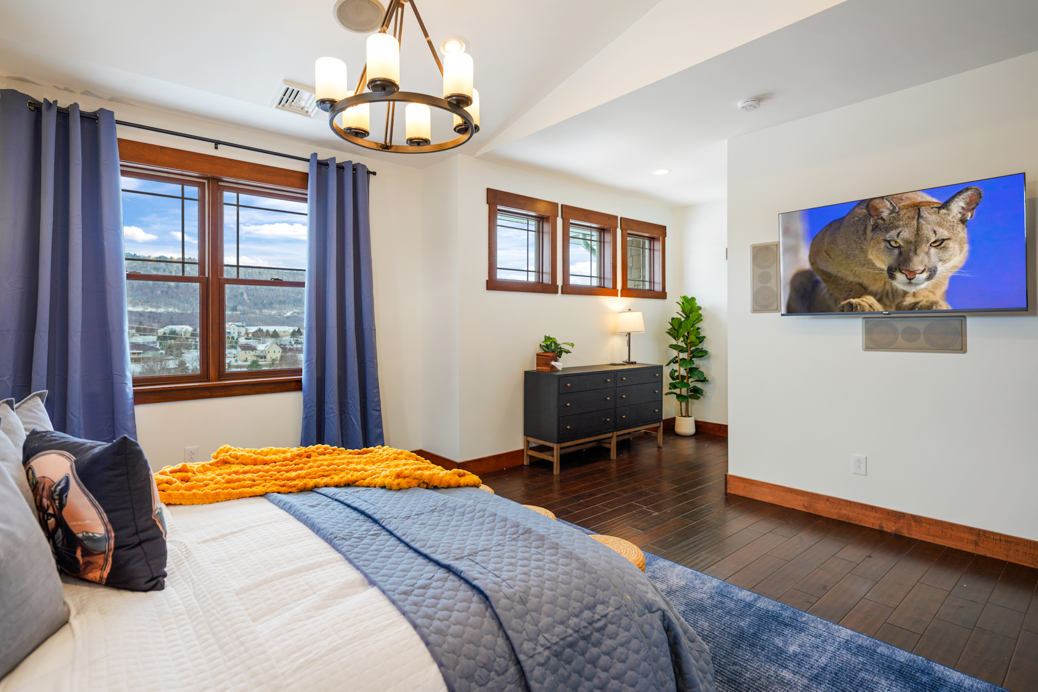 Spacious primary suite with king bed, seating, and scenic views — designed for comfort and privacy.