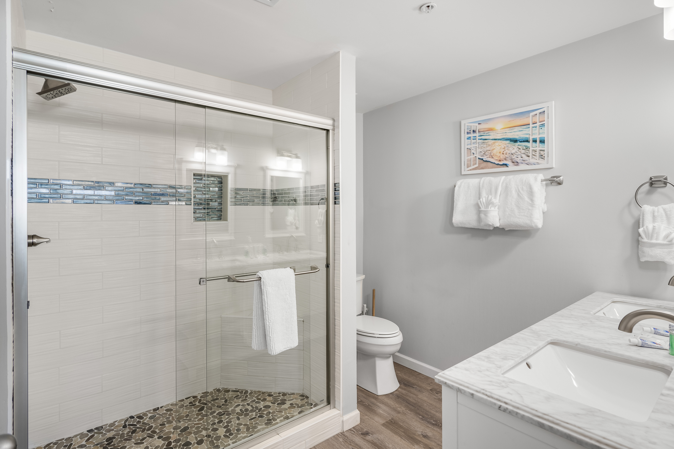 Master bathroom is remodeled with walk in shower and dual vanities