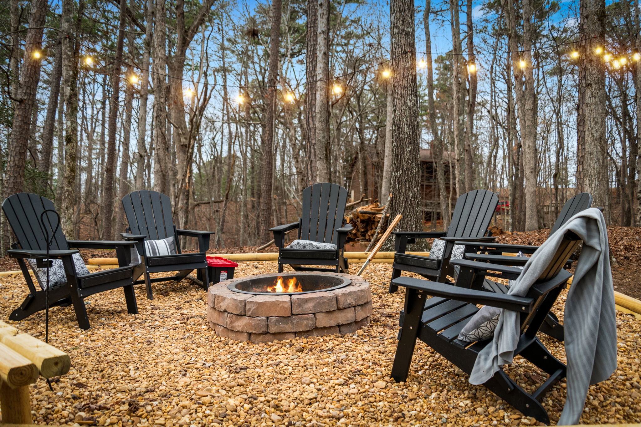 Outdoor fire pit area offers a warm and inviting space perfect for gathering with friends and family.