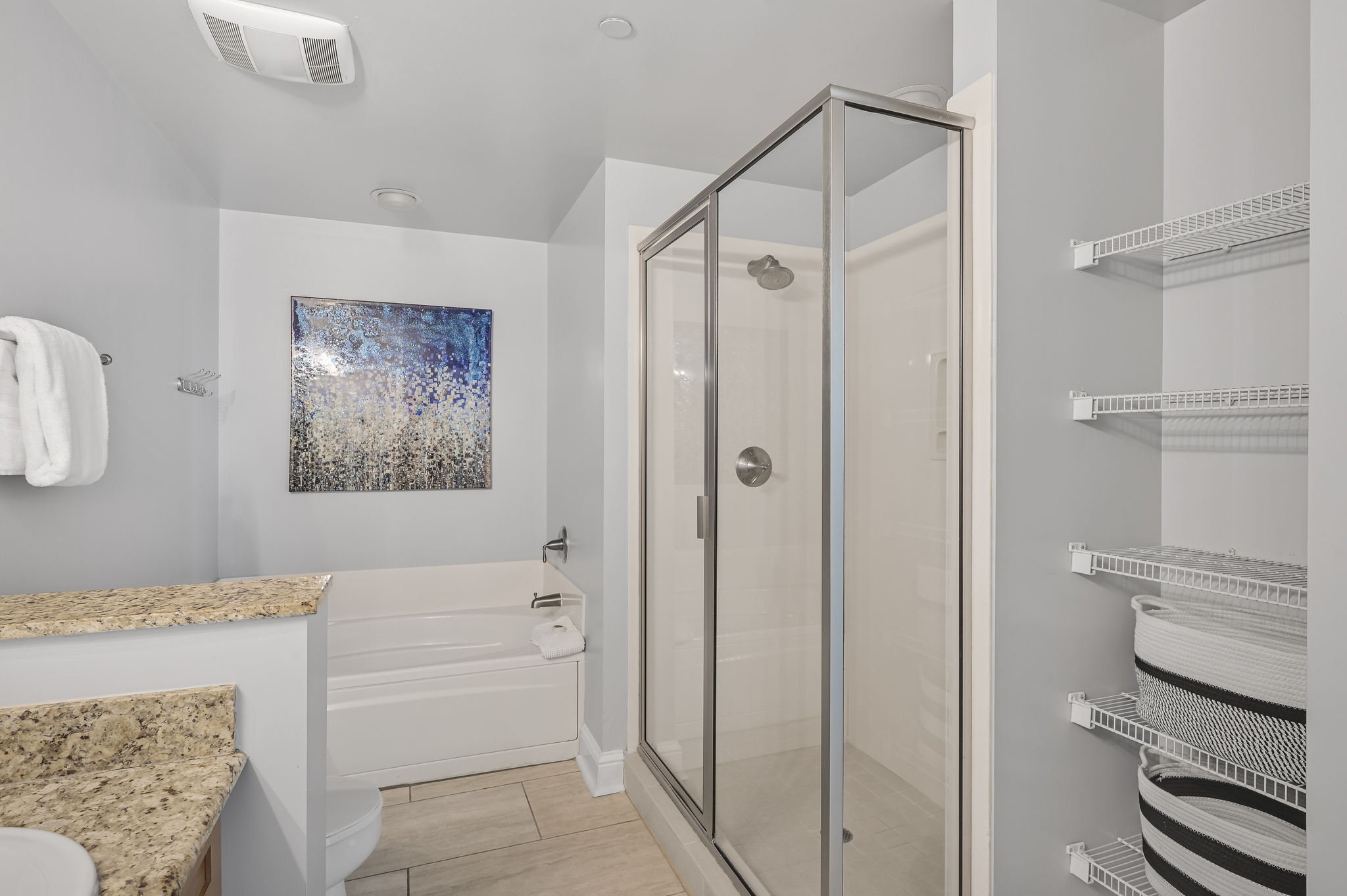 Large master bathroom with dual vanity, walk in shower, and soaker tub!