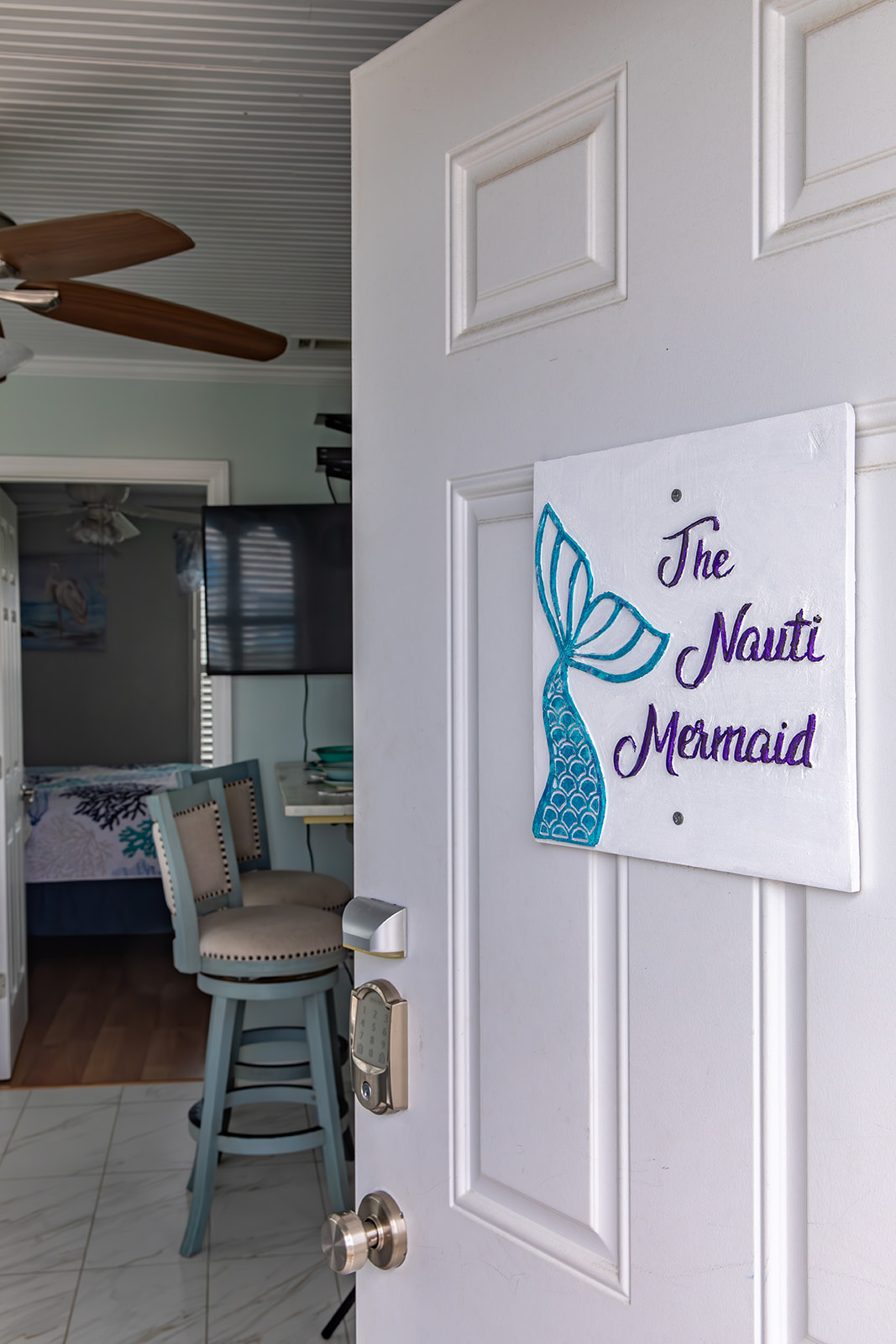 Step inside The Nauti Mermaid and get your first glimpse of the space. The entry opens directly into the condo, setting the tone for a clean, well-cared-for retreat just moments from the beach.