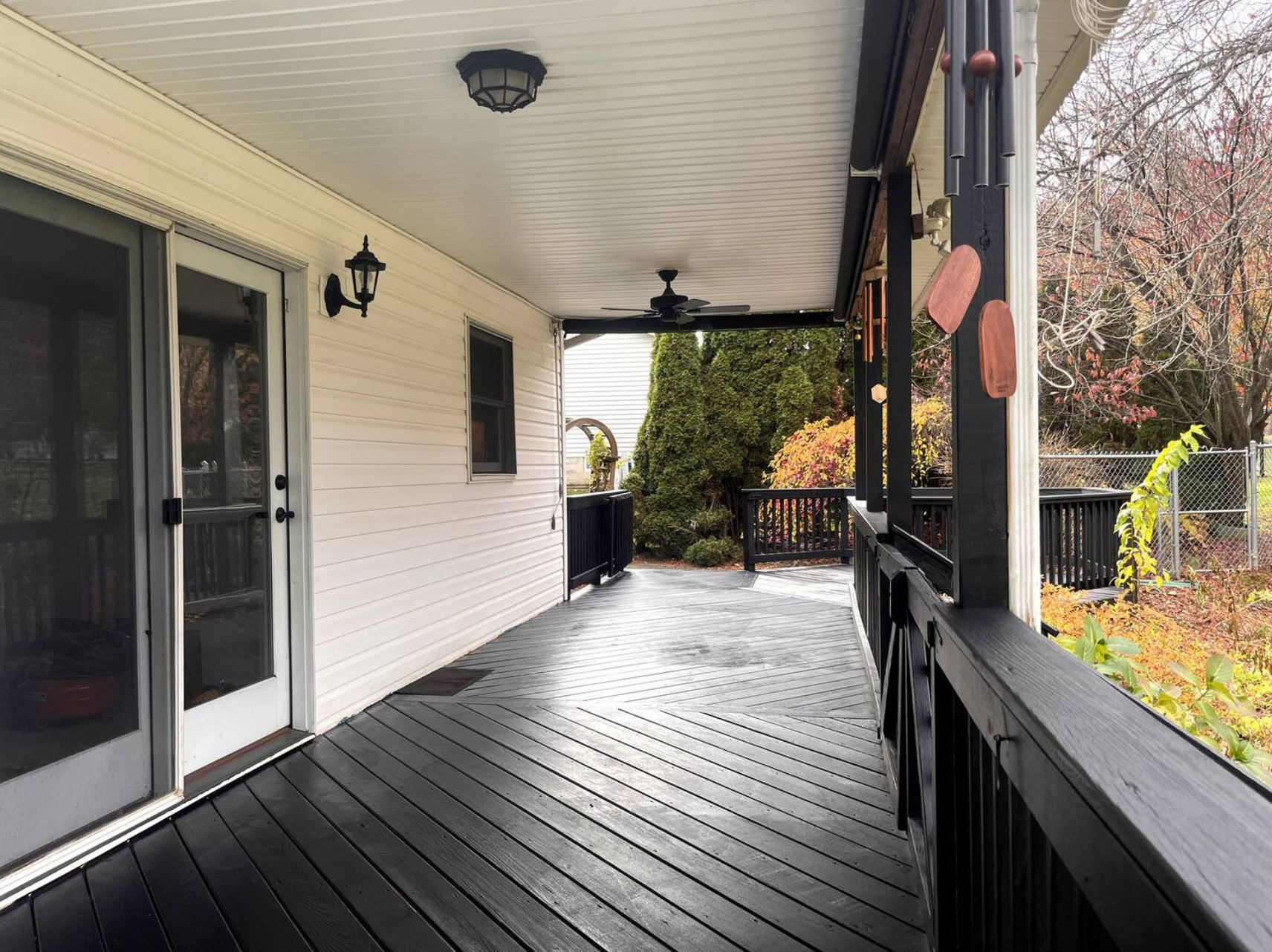 Full length porch with large fenced in back yard