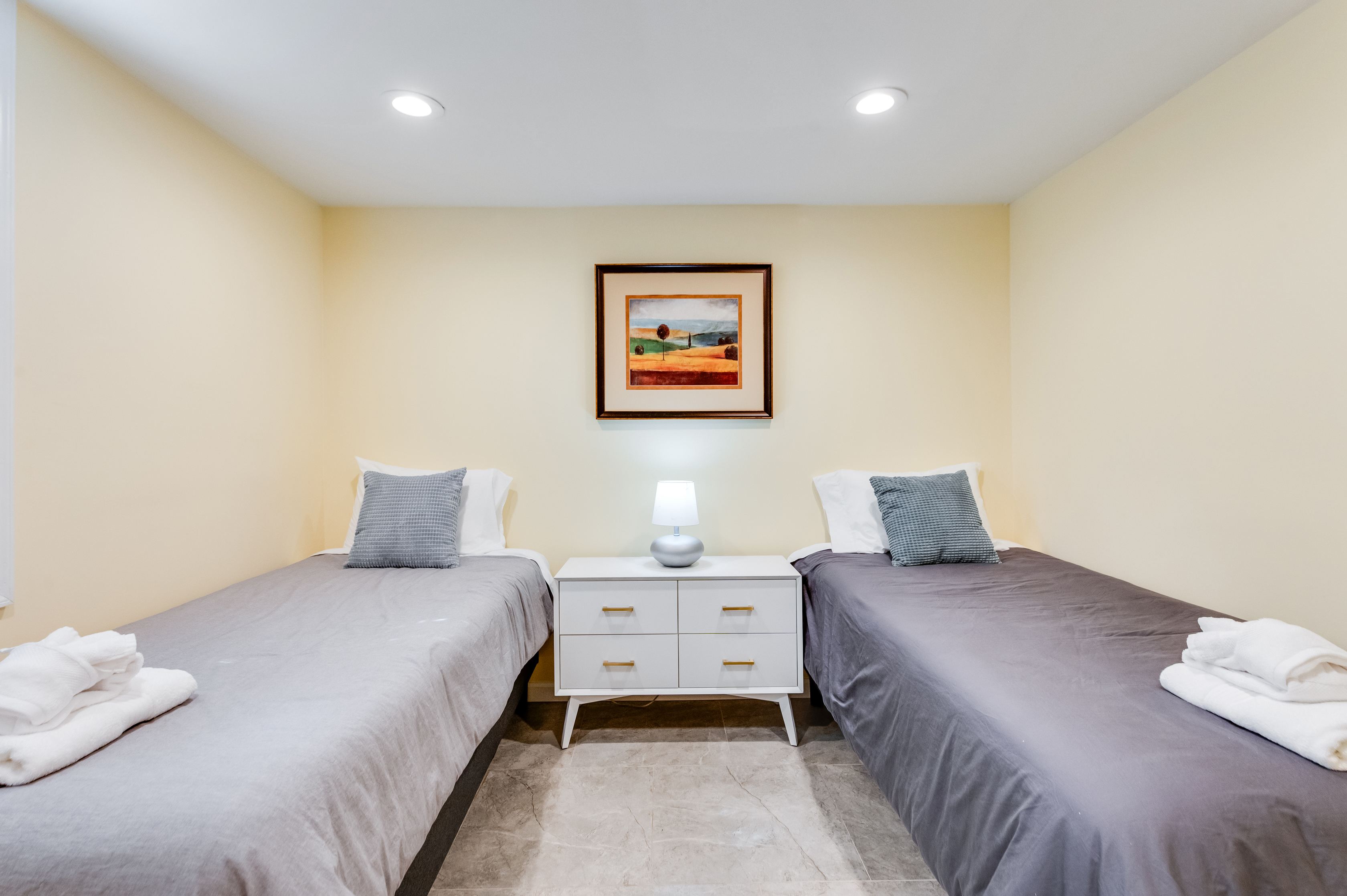 Downstairs Twin Bedroom 4: Bright and airy with stylish decor, perfect for a peaceful night’s rest!