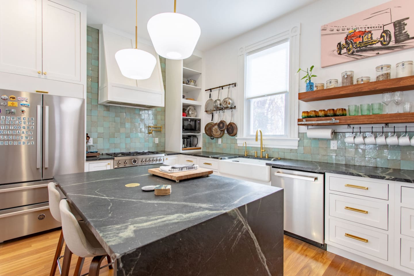 A complete view of the kitchen, featuring modern appliances, ample counter space, and stylish cabinetry, creating a functional and inviting cooking area.