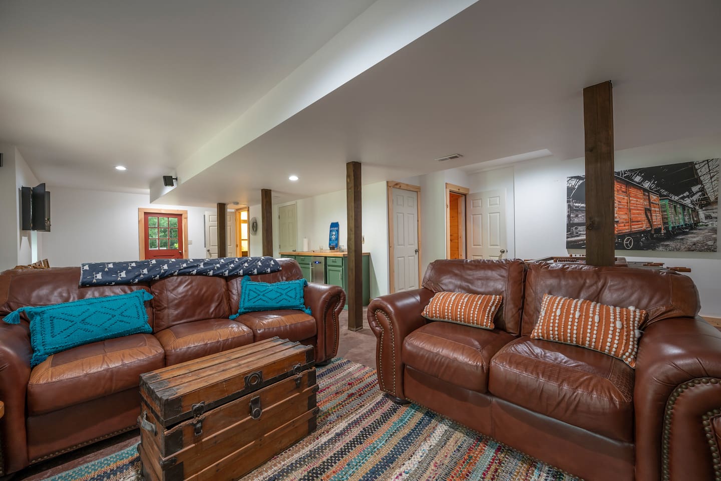Lower Level living room/game room with French doors to lower deck on river.
