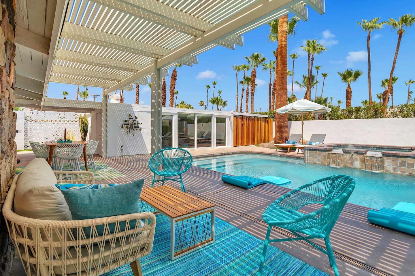 Private secluded pool with mountain and palm tree views - new fire column beside the outdoor sofa for cooler nights